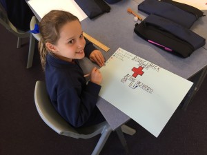 Matilda 3C designs her poster. 